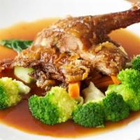 Roasted Rohan Tamarind Duck · Crispy duck with mixed vegetables in a sweet and sour tamarind sauce; gluten-free by request.