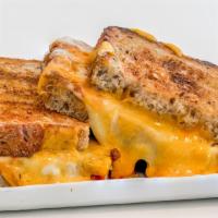 Triple Grilled Cheese (D) · Sharp cheddar
Mozzarella
Provolone
Toasted multigrain bread