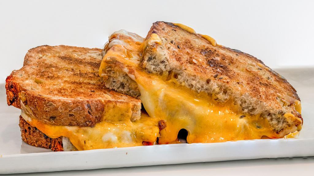 Triple Grilled Cheese (D) · Sharp cheddar
Mozzarella
Provolone
Toasted multigrain bread
