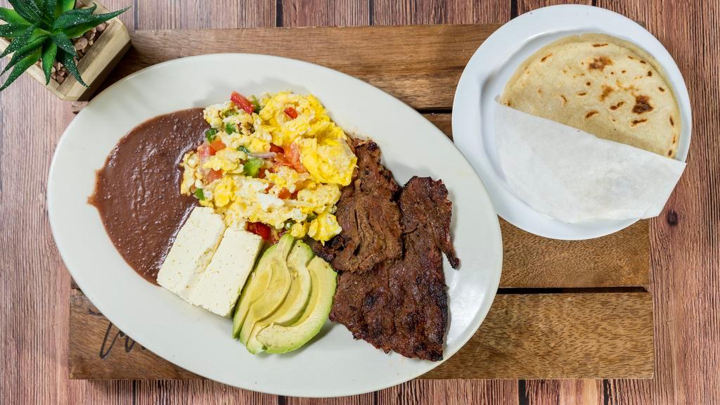 Desayuno Campestre · Two eggs any style served with spicy sausage, cheese, avocado, fried beans and tortillas.