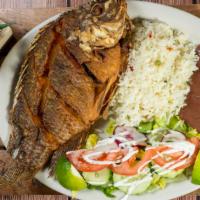 Mojarra Frita · Fried tilapia fish. Fried tilapia served with rice, beans, salad and tortillas.