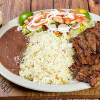 Carne Asada · Grilled steak. Served with beans, rice, salad and pico de gallo.
