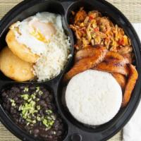 Pabellon Criollo · Rice, shredded beef, black beans, sweet plantains, eggs and two mini arepas.