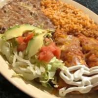 Enchiladas Plate · Pinto Beans, Rice, Two Corn Tortillas, Chicken or Beef, Cheese, Lettuce, Tomatoes, Sour Crea...