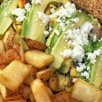 The Favorite · Three eggs scrambled with goat cheese, sundried tomatoes, avocado, mushrooms & basil, served...