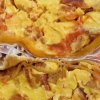 Breakfast Wrap · Scrambled eggs, bacon, cheddar cheese & tomatoes wrapped in a whole-wheat tortilla, served w...