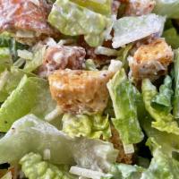 Caesar Salad · Romaine lettuce, parmesan cheese & croutons served with our caesar dressing