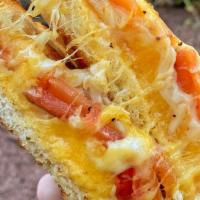 Ultimate Grilled Cheese · Gruyere, cheddar & parmesan cheese grilled to perfection with roasted tomatoes