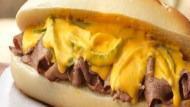 Philly Cheesesteak · Steak, American cheese, sautéed onion, peppers, and mushrooms.