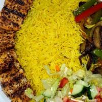 Grilled Salmon · Salmon fillet served with our special sauce, basmati rice, sautéed veggies, and side salad. ...
