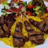 Lamb Chops · Lamb Chops (4pcs) served with our special sauce, basmati rice, sautéed veggies, and side sal...