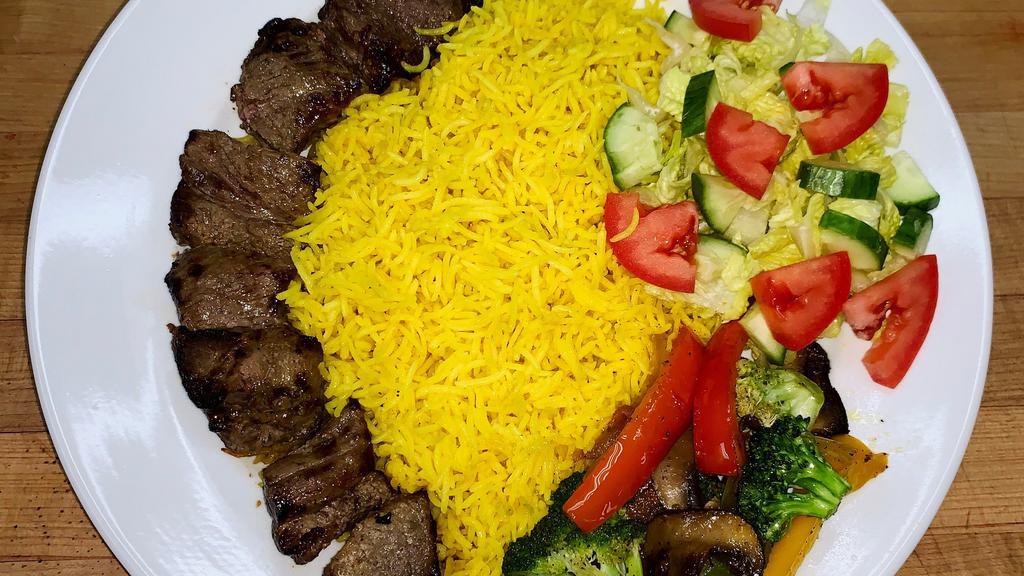 Lamb Kebab · Lamb sirloin served with our special sauce, basmati rice, sautéed veggies, and side salad. (gluten free)