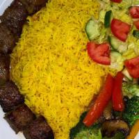 Beef Kebab · Boneless beef tenderloin served with our special sauce, basmati rice, sautéed veggies, and s...