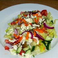Garden Salad · Lettuce, tomato, cucumber, olives, carrot, red onion, and feta cheese, drizzled with lemon j...