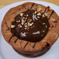 Chocolate Caramel Crunch · A flourless chocolate cake filled with crunchy almond bits, topped with creamy caramel and h...