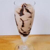 Hazelnut Chocolate Flute · Smooth hazelnut gelato, swirled with rich chocolate sauce