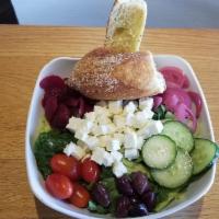 Mediterranean Entree Salad · house blend lettuce, kalamata olives, beets, tomato, marinated red onion, cucumber, feta, wi...