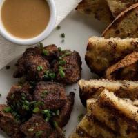 Steak Tips · beef tenderloin, zip sauce, grilled sourdough.