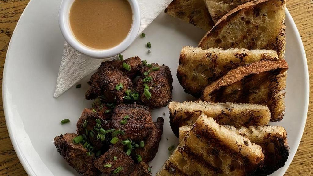 Steak Tips · beef tenderloin, zip sauce, grilled sourdough.