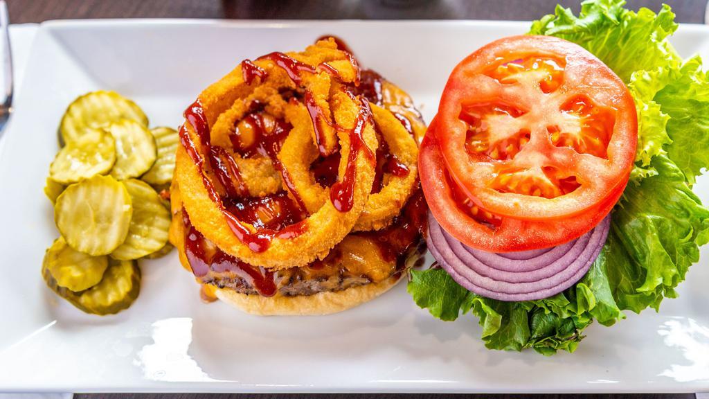 Bbq Burger · Onion rings, Cheddar, lettuce, tomato.