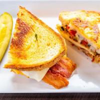 Super Chicken Melt Sandwich · Bacon, grilled onions and peppers, Swiss and American.