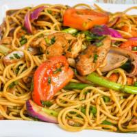 Tallarin Saltado · Tender steak or chicken wok sautéed in olive oil with onions, tomatoes, and fettuccine.