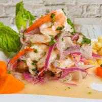 Ceviche Mixto · Fresh fish and seafood marinated in lime juice, mixed with special spices. Served with sweet...