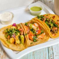 Tacos · Tortilla with your protein of your choice, pico de gallo, sour cream, lettuce, and shredded ...