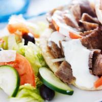 Gyro Salad · Greek salad made with grilled pita, and fresh gyro. Served with a side of tzatziki sauce.