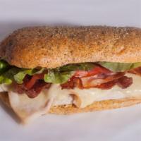 Turkey Club Sub · Tasty turkey sub with crispy bacon, fresh lettuce and tomatoes, and creamy mayo.