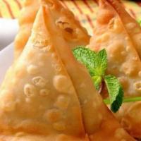 Samosa (2) · Minced potatoes & peas wrapped in pastry dough & fried
