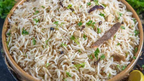 Jeera Rice · Fried rice cooked in a special pan with mixed vegetables and cumin seeds.