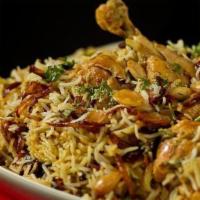 Chicken Biryani  · Chicken and Basmati rice cooked with fresh herbs & spices