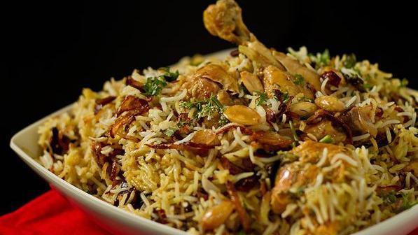 Chicken Biryani  · Chicken and Basmati rice cooked with fresh herbs & spices