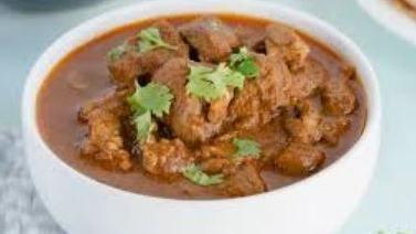 Lamb Curry · Lamb pieces cooked with special onions and tomato sauce