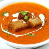 Tomato Soup  · Pieces of tomatoes in a fragrant soup with fresh herbs and spices
