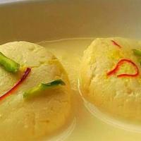Ras Malai (2) · Cottage cheese & milk flavored with rose water & garnished with nuts