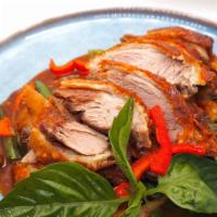 Duck Basil · Boneless duck fried until crispy with onions, bell peppers, string beans in chili basil sauce.