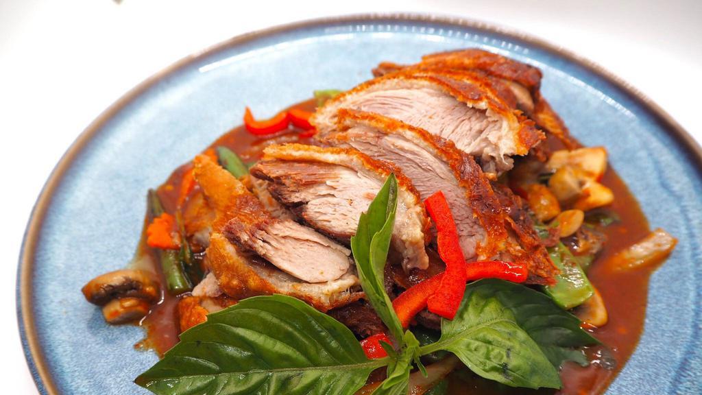 Duck Basil · Boneless duck fried until crispy with onions, bell peppers, string beans in chili basil sauce.