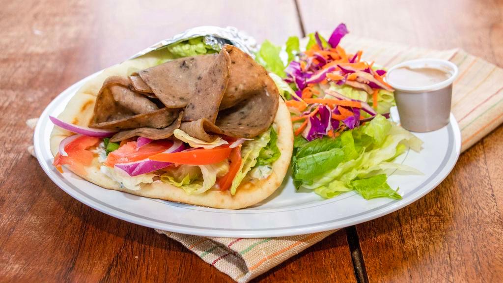 Gyro Wrap · Beef and lamb gyro, lettuce, tomato, onion and tzatziki sauce with your choice of additional toppings.