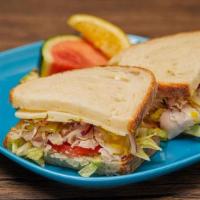 Turkey Deli Sandwich · Deli sandwich served cold with Mayo, Lettuce, and Tomato on your choice of bread. Topped wit...