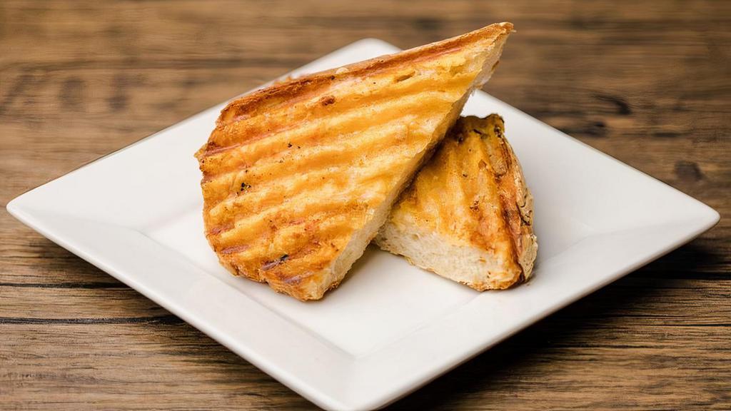 Garlic Bread · Italian bread, lightly toasted and served with garlic infused butter. For the cheese lovers out there, you can now choose our cheesy garlic bread! We top your garlic bread with aged parmesan prior to grilling.