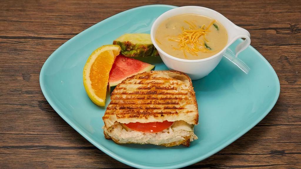 Half Sandwich And Cup Of Soup · A perfect match for a quick or light lunch! Your choice of a half panini and a 8oz cup of soup. Add a drink or chips to make it a full meal!