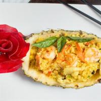 Pineapple Fried Rice · Curry flavored Rice with green red pepper,onion,eggs, cashew, pineapple, raisin, chicken and...