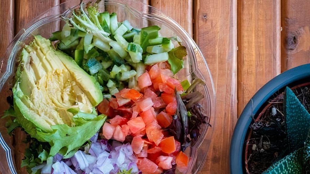 California Salad · Fresh Greens, Cucumber, Tomatoes, Onions, Avocado with House Made Vinaigrette