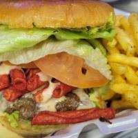 Takis Burger · 1/3 lb., queso cheese, takis, guacamole, lettuce, tomato.