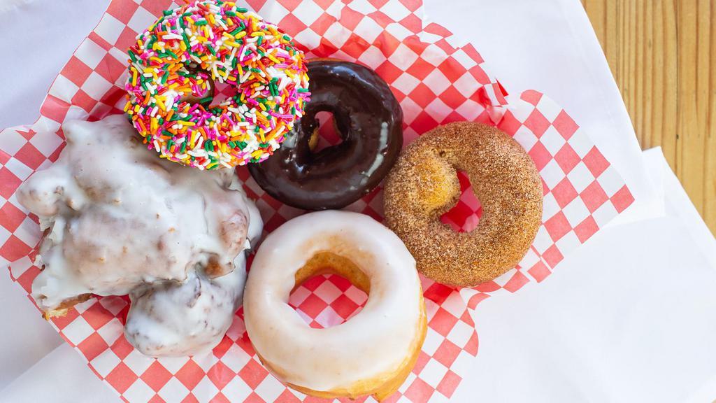Assorted · We believe the best donuts are made with the best ingredients. Our Montana wheat flour is non-GMO, our sugar is organic. Our glazes, toppings, and fillings are made with seasonal ingredients and honest craft. Half standard and half premium.