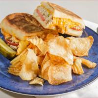 Tuna Melt Panini · Our delicious tuna salad topped with cheddar cheese on a bed of sliced tomatoes.