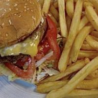 Cheeseburger With Fries · Juicy homemade hamburger served on a grilled bun then topped with cheese,  lettuce, tomato, ...