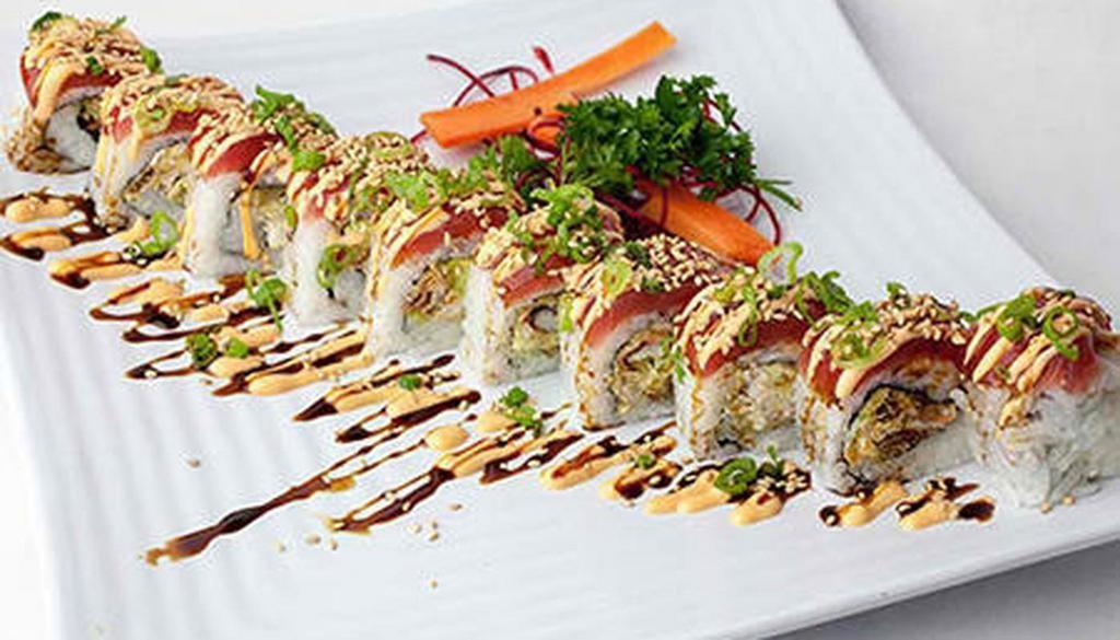 Maui Wowie Roll · Soft shell crab tempura, avocado, cream cheese, topped with tuna, spicy mayo, sweet soy, scallions and sesame seeds.